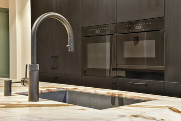 Close up of elegant sink in luxury kitchen