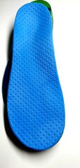 Individual orthopedic insoles for shoes in blue. Children's insoles for foot correction. Medical insoles.