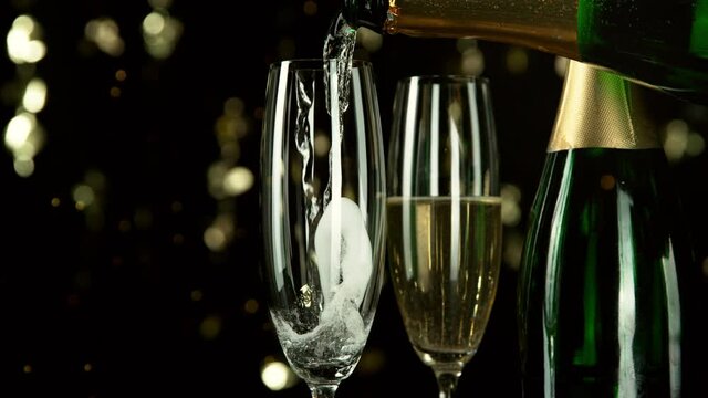 Super slow motion of pouring champagne wine with camera motion. Filmed on high speed cinema camera, 1000fps.