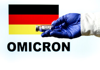 Hand holding vial with covid vaccine