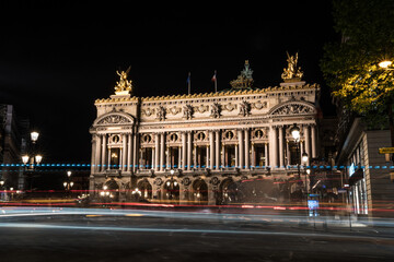 Fototapeta na wymiar Famous Paris Opera at Night, lights of the traffic leading around
