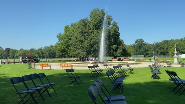 Munich, Germany - September 4, 2021: Preparing for an open-air concert in the courtyard of an old palace by the fountain. At a children's concert at the Bavarian International School.