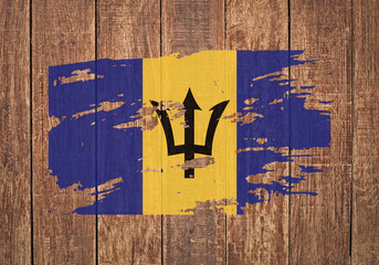 Flag of Barbados, grunge, on a wooden background