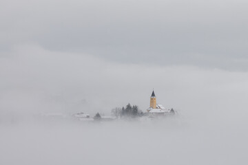 Winter in Croatia. Church. Fog. Snow