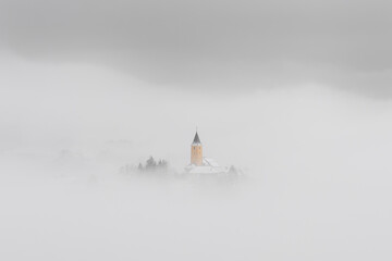Winter in Croatia. Church. Fog. Snow