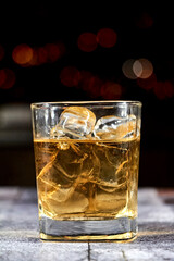 cocktail in a transparent glass with a starry black background