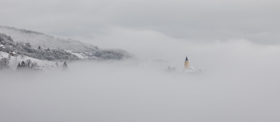 Winter in Croatia. Church. Fog. Snow