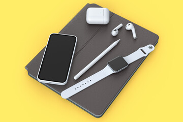 Computer tablet with stylus, smartwatch phone and headphone on yellow background