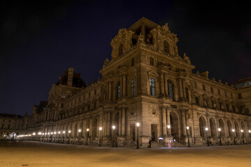 Fototapeta na wymiar Beautiful facade of the Louvre Palace in Paris at night