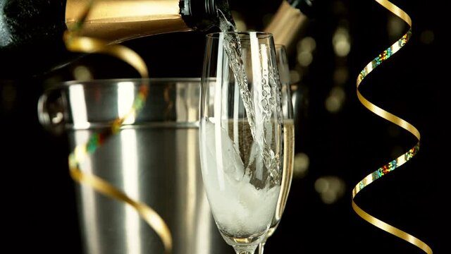 Super slow motion of pouring champagne wine with camera motion. Speed ramp effect. Filmed on high speed cinema camera, 1000fps.