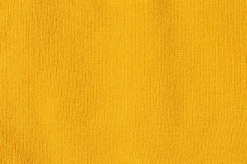 Knitted texture close-up, bright yellow color, background