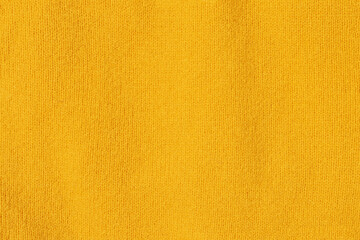 Knitted texture close-up, bright yellow color, background