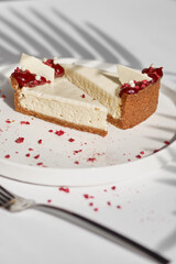 Sliced Cheesecake. Layer of biscuits, mousse based on creamcheese, with raspberry. Healthy dessert.