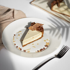 Sliced Cheesecake. Layer of biscuits, mousse based on creamcheese, with chocolate cream. Healthy dessert.