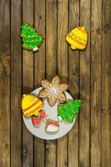 Gingerbread cookies on wooden background. Holiday concept. Christmas time.