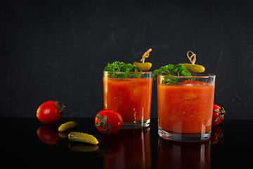 Alcohol cocktail Bloody Mary on dark background. Classic cocktail with tomato juice and vodka