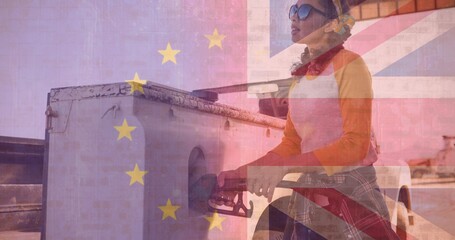 Digital composite image of woman refueling with pump and british along with european union flag