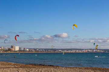 Kite surfers in Can Pastilla, Majorca. Mediterranean sea.