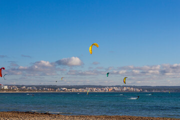 Kite surfers in Can Pastilla, Majorca. Mediterranean sea.