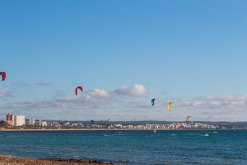 Kite surfers in Can Pastilla, Majorca. Mediterranean sea.