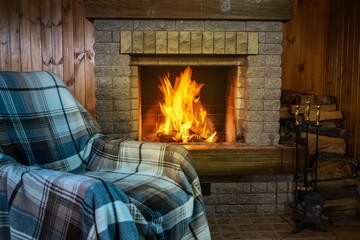 The place for relaxation before cozy fireplace in country house, winter vacation.