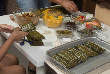Traditional Venezuelan cuisine for the December festivities, Hallacas are a typical dish that is prepared as a family and represents ancestral traditions of a mixture of ingredients wrapped in leaves