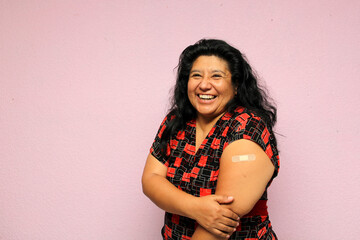Body positive overweight adult laina woman shows her arm recently vaccinated against Covid-19 in...