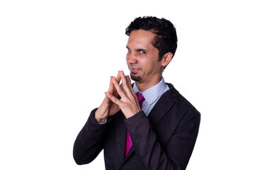 Bad man plans something evil. Businessman makes evil gesture by clasping his hands together and imitating Mr. Burns. Isolated on a totally white background. - obrazy, fototapety, plakaty