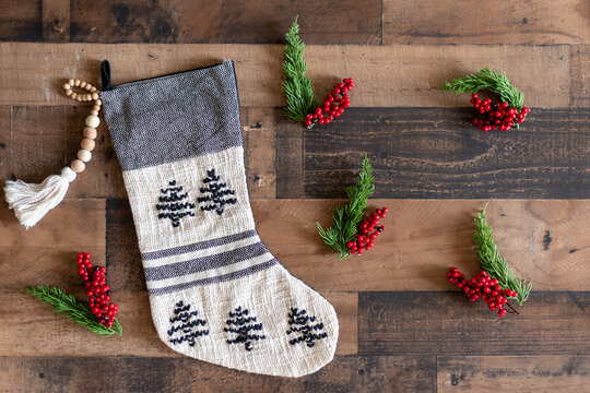 Modern black and white Christmas stocking on rustic wood background