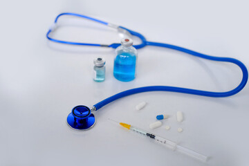 medical stethoscope, syringe, blue vaccine vials, medicine, concept of maintaining health, medication treatment, vaccination against coronavirus covid 19