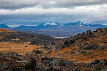 Fototapeta premium The view from a hiking trail between Laktatjakka and Trollsjon lake towards the border with Norway, Sweden, October 2021.