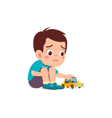 cute boy play toy car alone and feel sad