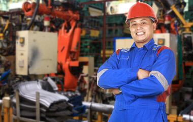 portrait of asian engineer wearing safety jacket and helmet in factory