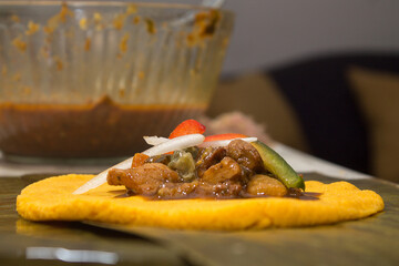 Traditional Venezuelan cuisine for the December festivities, Hallacas. Typical dish of ancient traditions where a mixture of ingredients are wrapped in banana leaves