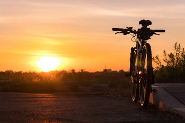 Beautiful close up scene of bicycle at sunset