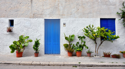 Fototapeta na wymiar Picturesque door and window in the center of San Vito Lo Capo Sicily Italy