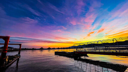 Obraz premium sunset over the river