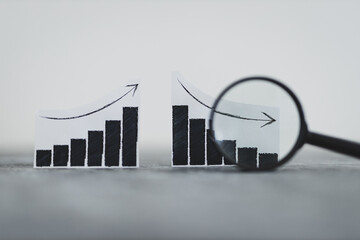 financial markets or money and investments, charts showing upward and downward trends next to each...