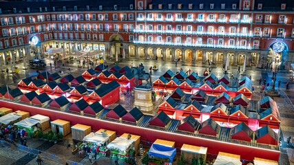 Stalls of the Christmas Market in the Plaza Mayor of the city of Madrid, with Christmas lighting