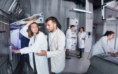Group of adults trying to get out of the escape room stylized under the laboratory