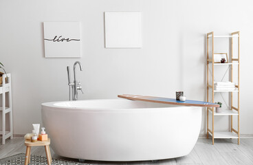 Bathtub with surfboard in modern interior of bathroom