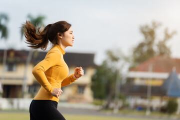 woman running in the park in early morning