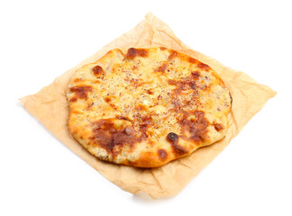 Parchment with tasty khachapuri on white background