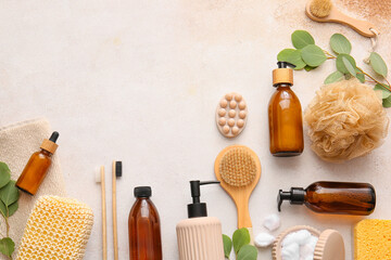 Set of bath supplies with loofah sponges and plant branches on white background