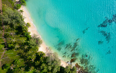 High aerial view of azure waters, white sandy beaches and rich forest nature on Koh Kood in Thailand.