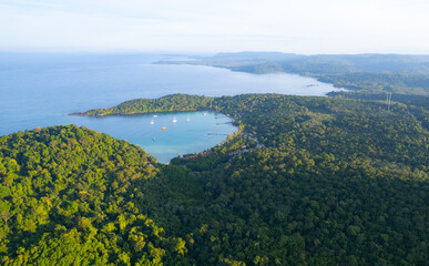 igh aerial view of azure waters, white sandy beaches and rich forest nature on Koh Kood in Thailand.