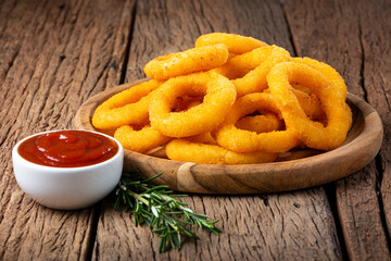 Crispy onion rings with ketchup.