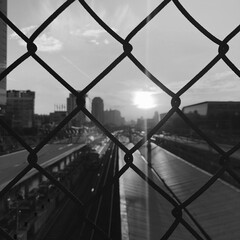 sun between iron bars