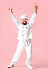 Dancing male chef on pink background