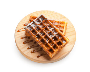 Board with delicious Belgian waffles and jam on white background